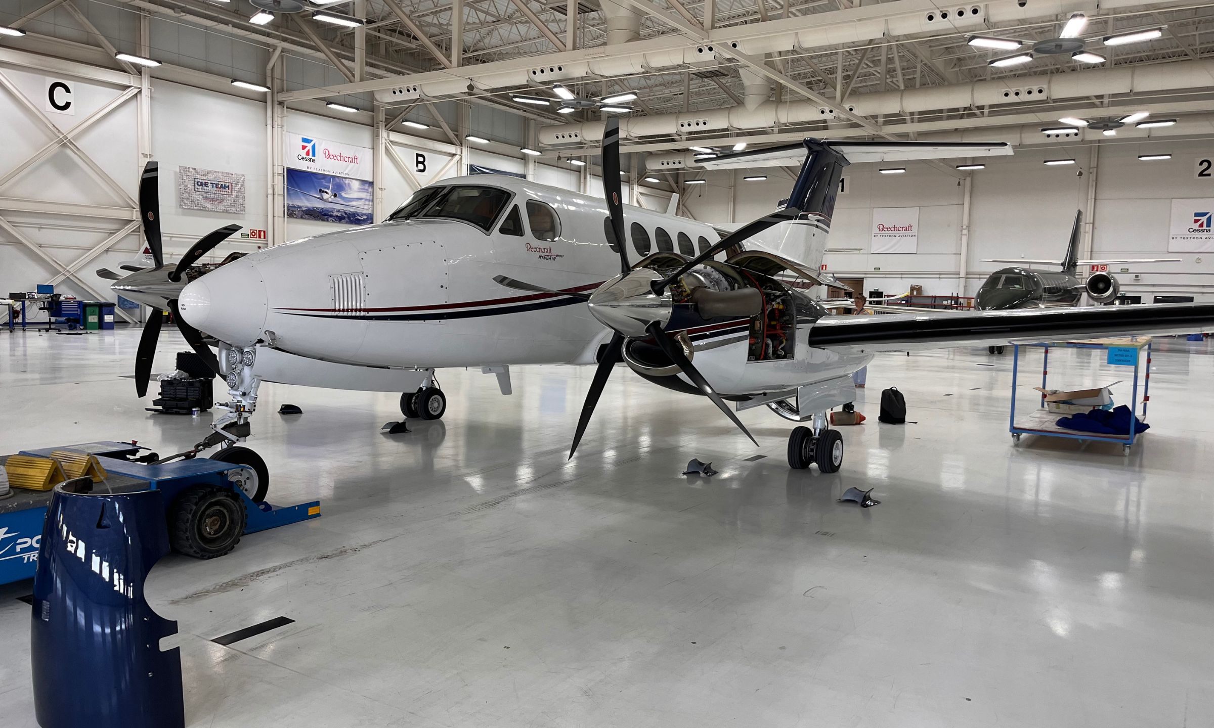 King Air B200GT undergoing maintenance inside a certified aircraft hangar.