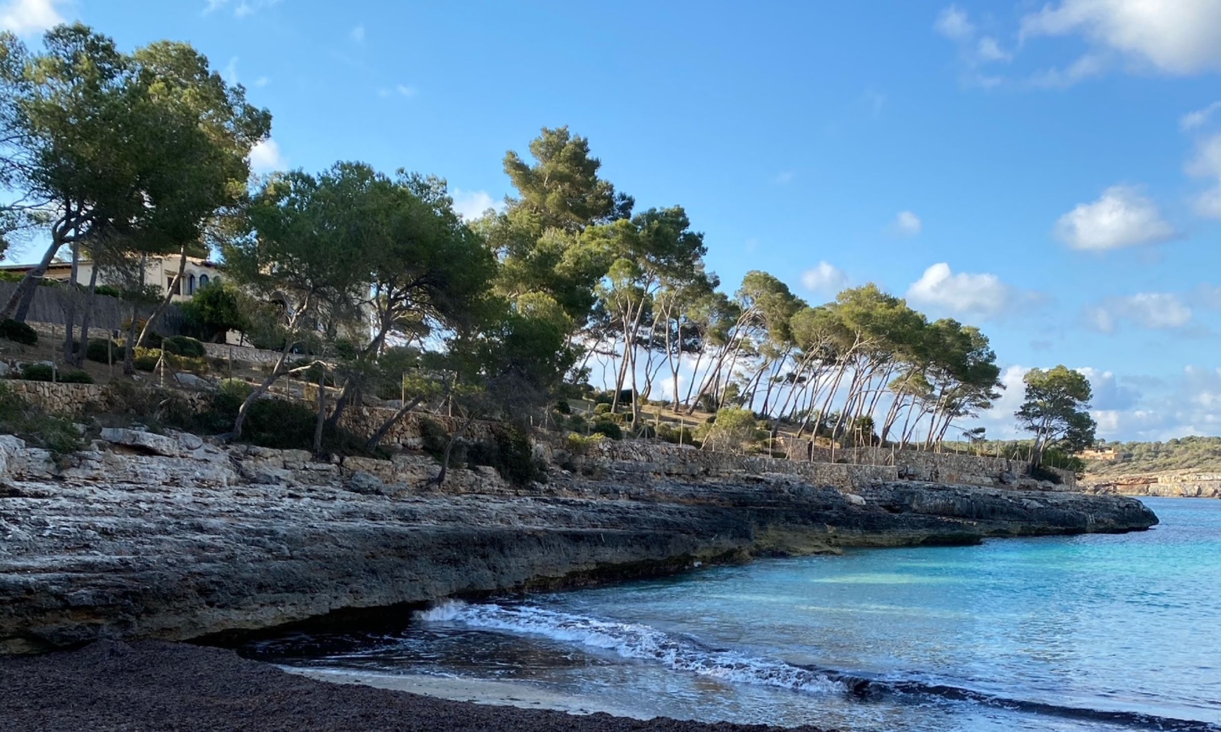 Secluded cove with crystal-clear water in Mallorca, Spain.